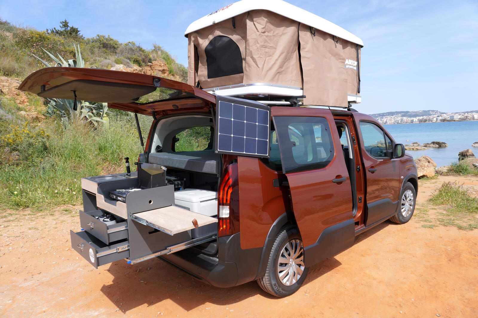 Interior of a WanderVans camper van with equipment laid out