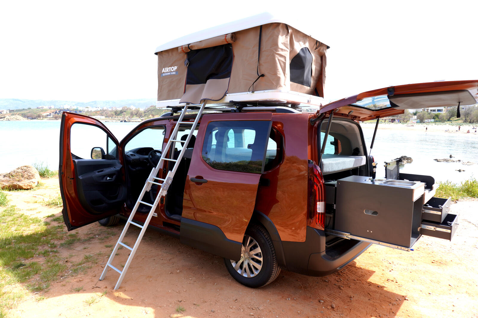 Camper van with solar panel by the sea in Crete